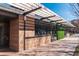 Exterior of the community building with modern wood design, an outdoor terrace, and a walkway leading to the entrance at 10 Perimeter Summit Ne Blvd # 4315, Brookhaven, GA 30319