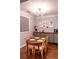 Charming dining area with a round wooden table, stylish chairs, and modern lighting fixture at 10 Perimeter Summit Ne Blvd # 4315, Brookhaven, GA 30319