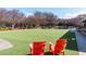 Expansive green space with Adirondack chairs and views of the community's manicured grounds at 10 Perimeter Summit Ne Blvd # 4315, Brookhaven, GA 30319