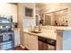 Modern kitchen featuring stainless steel appliances, white cabinets, and a countertop bar for casual dining at 10 Perimeter Summit Ne Blvd # 4315, Brookhaven, GA 30319