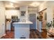 Modern kitchen features stainless steel appliances, white cabinets, backsplash and breakfast bar at 10 Perimeter Summit Ne Blvd # 4315, Brookhaven, GA 30319