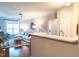 Living room with white countertop bar area, large window, and stylish furniture and decor at 10 Perimeter Summit Ne Blvd # 4315, Brookhaven, GA 30319