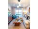 Bright living room with a large window, comfortable seating, and stylish decor with light colored walls at 10 Perimeter Summit Ne Blvd # 4315, Brookhaven, GA 30319