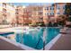 A relaxing pool surrounded by lounge chairs, umbrellas, and trees that offer a tranquil oasis for residents at 10 Perimeter Summit Ne Blvd # 4315, Brookhaven, GA 30319