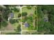 Aerial view of the property line that surrounds the house with mature trees, and lush landscaping at 123 Nelson Street, Newborn, GA 30056