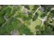 An aerial view showing the lush greenery surrounding the property including mature trees and landscaping at 123 Nelson Street, Newborn, GA 30056