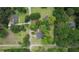 An aerial perspective showcases a property nestled amongst lush greenery, surrounded by neighboring houses at 123 Nelson Street, Newborn, GA 30056