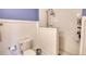 Bathroom features a shower with white subway tile and blue-painted wall at 123 Nelson Street, Newborn, GA 30056