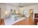 Bright bedroom featuring hardwood floors and a doorway leading to another room at 123 Nelson Street, Newborn, GA 30056