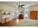 Bedroom with hardwood floors, two windows, and a decorative fireplace at 123 Nelson Street, Newborn, GA 30056