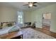 Cozy bedroom with hardwood floors and soft natural light for a restful retreat at 123 Nelson Street, Newborn, GA 30056