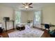 Bright, airy bedroom with hardwood floors, soft natural light and comfortable decor at 123 Nelson Street, Newborn, GA 30056
