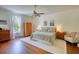Spacious bedroom with a ceiling fan, hardwood floors, and plenty of natural light at 123 Nelson Street, Newborn, GA 30056