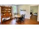 Charming dining room with hardwood floors, decorative hutch, and seating for four at 123 Nelson Street, Newborn, GA 30056