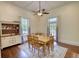 Bright dining room with hardwood floors and neutral walls, perfect for entertaining guests at 123 Nelson Street, Newborn, GA 30056