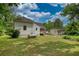 Home exterior showing yard, propane tank and outbuilding at 123 Nelson Street, Newborn, GA 30056