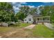 Charming home with picket fence, inviting front porch, and bonus outbuilding offers classic appeal at 123 Nelson Street, Newborn, GA 30056