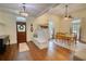 Elegant foyer featuring hardwood floors, stylish lighting, and an inviting dining area at 123 Nelson Street, Newborn, GA 30056