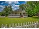 Charming one-story home with a welcoming porch and large front lawn at 123 Nelson Street, Newborn, GA 30056