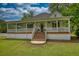 Charming one-story home with a welcoming porch and large front lawn at 123 Nelson Street, Newborn, GA 30056