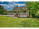 Charming one-story home with a welcoming porch and large front lawn at 123 Nelson Street, Newborn, GA 30056