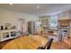 Bright eat-in kitchen featuring stainless steel appliances, brick accents, and custom cabinetry at 123 Nelson Street, Newborn, GA 30056