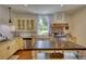 Well-appointed kitchen featuring granite counters, stainless appliances, a center island, and custom cabinetry at 123 Nelson Street, Newborn, GA 30056