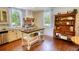 Modern kitchen with stainless steel appliances, a butcher block island, and ample natural light at 123 Nelson Street, Newborn, GA 30056