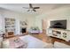 Cozy living room features a fireplace, built-in shelves, and an entertainment center, providing a comfortable living space at 123 Nelson Street, Newborn, GA 30056