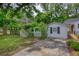 Outbuilding with gated garden area and concrete driveway is a versatile backyard addition at 123 Nelson Street, Newborn, GA 30056