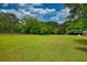 Broad backyard with outbuildings in a wide expanse at 123 Nelson Street, Newborn, GA 30056