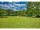 Wide view of the large yard with outbuildings at 123 Nelson Street, Newborn, GA 30056