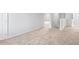 Upstairs landing featuring neutral carpet, white trim, and open doors at 1707 Bouquet Way, Mcdonough, GA 30253