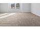 Bedroom with neutral carpet, bright natural light, and a large window at 1707 Bouquet Way, Mcdonough, GA 30253