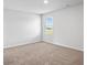 Bedroom filled with natural light, featuring neutral carpet at 1707 Bouquet Way, Mcdonough, GA 30253