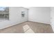 Neutral bedroom with plush carpet, bright natural light, and a large window at 1707 Bouquet Way, Mcdonough, GA 30253