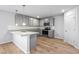Kitchen with stainless steel appliances, gray cabinets, tile back splash, and hard wood floors at 1707 Bouquet Way, Mcdonough, GA 30253