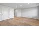 Spacious living room with hard wood flooring and two doorways for access at 1707 Bouquet Way, Mcdonough, GA 30253