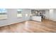 Living room area featuring beautiful hardwood floors, stainless steel appliances and view to the backyard at 1707 Bouquet Way, Mcdonough, GA 30253
