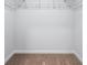 Empty walk-in closet with wall to wall carpeting and wire shelving awaiting customization at 1707 Bouquet Way, Mcdonough, GA 30253