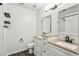 Bright bathroom with a dual sink vanity, framed mirrors, and dark bronze fixtures at 216 Buckland Dr, Alpharetta, GA 30022