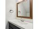 Clean half-bathroom features white countertops and a framed mirror at 216 Buckland Dr, Alpharetta, GA 30022