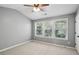 Neutral bedroom with tree views and ceiling fan at 216 Buckland Dr, Alpharetta, GA 30022