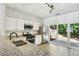 Bright kitchen features stainless steel appliances, light countertops, and access to backyard at 216 Buckland Dr, Alpharetta, GA 30022