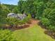 Aerial view of the house and lot surrounded by lush greenery at 3142 Chamblee Gap Rd, Cumming, GA 30040