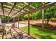 Back deck with pergola, seating, and view of the large landscaped backyard at 3142 Chamblee Gap Rd, Cumming, GA 30040