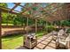 Back deck with pergola and view of the large landscaped backyard at 3142 Chamblee Gap Rd, Cumming, GA 30040