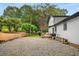Spacious backyard with gravel area, pergola, and patio seating at 3142 Chamblee Gap Rd, Cumming, GA 30040