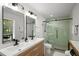 Bathroom featuring a glass shower door, double vanity, and modern fixtures at 3142 Chamblee Gap Rd, Cumming, GA 30040