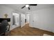 This bedroom has hardwood floors and a walk in bathroom at 3142 Chamblee Gap Rd, Cumming, GA 30040
